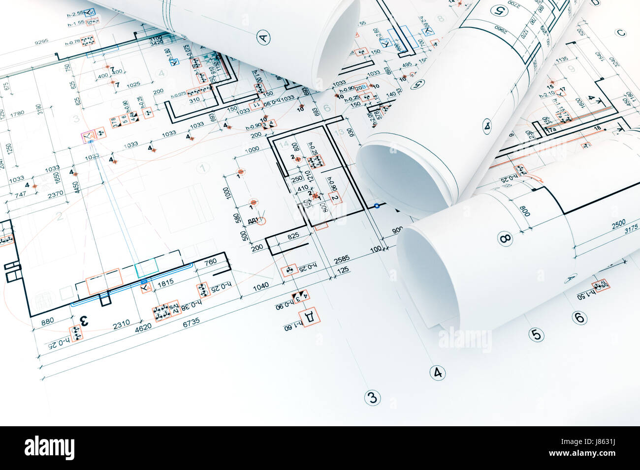 architectural project plan and rolled blueprints for home renovation Stock Photo