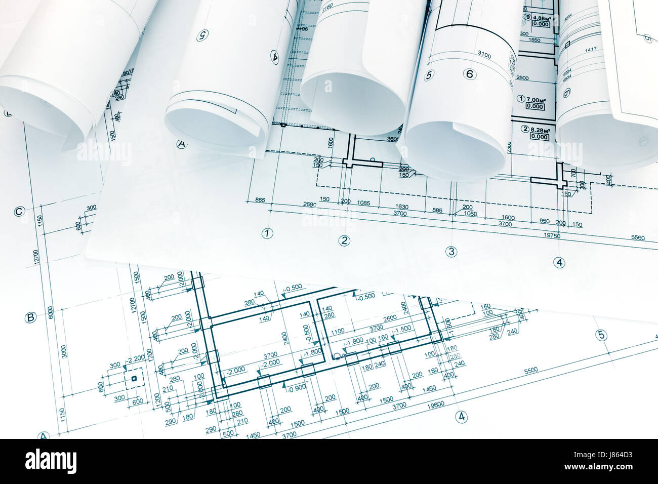 engineering and architectural drawings with rolls of blueprints Stock Photo