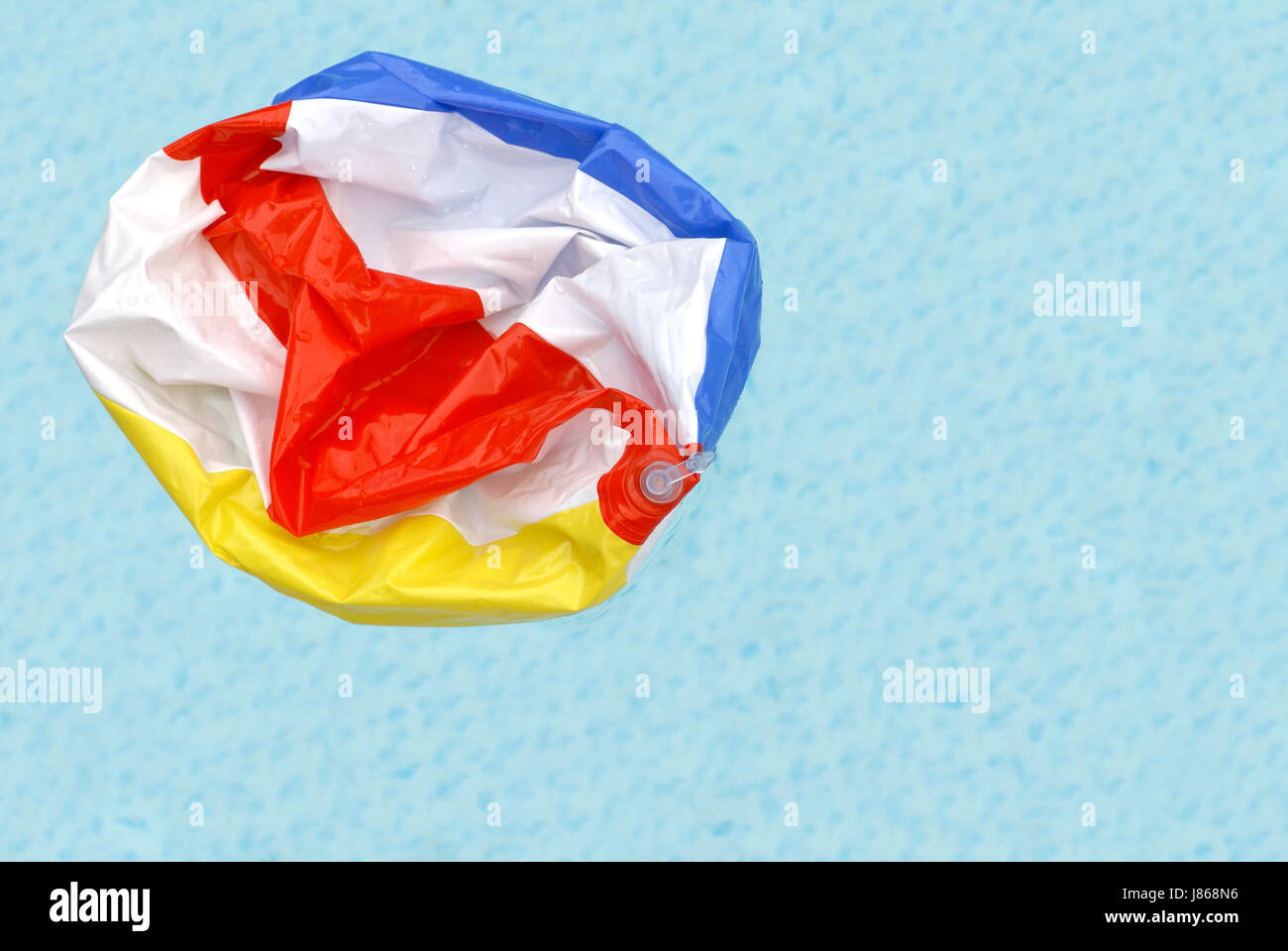 Deflated beach ball hi-res stock photography and images - Alamy