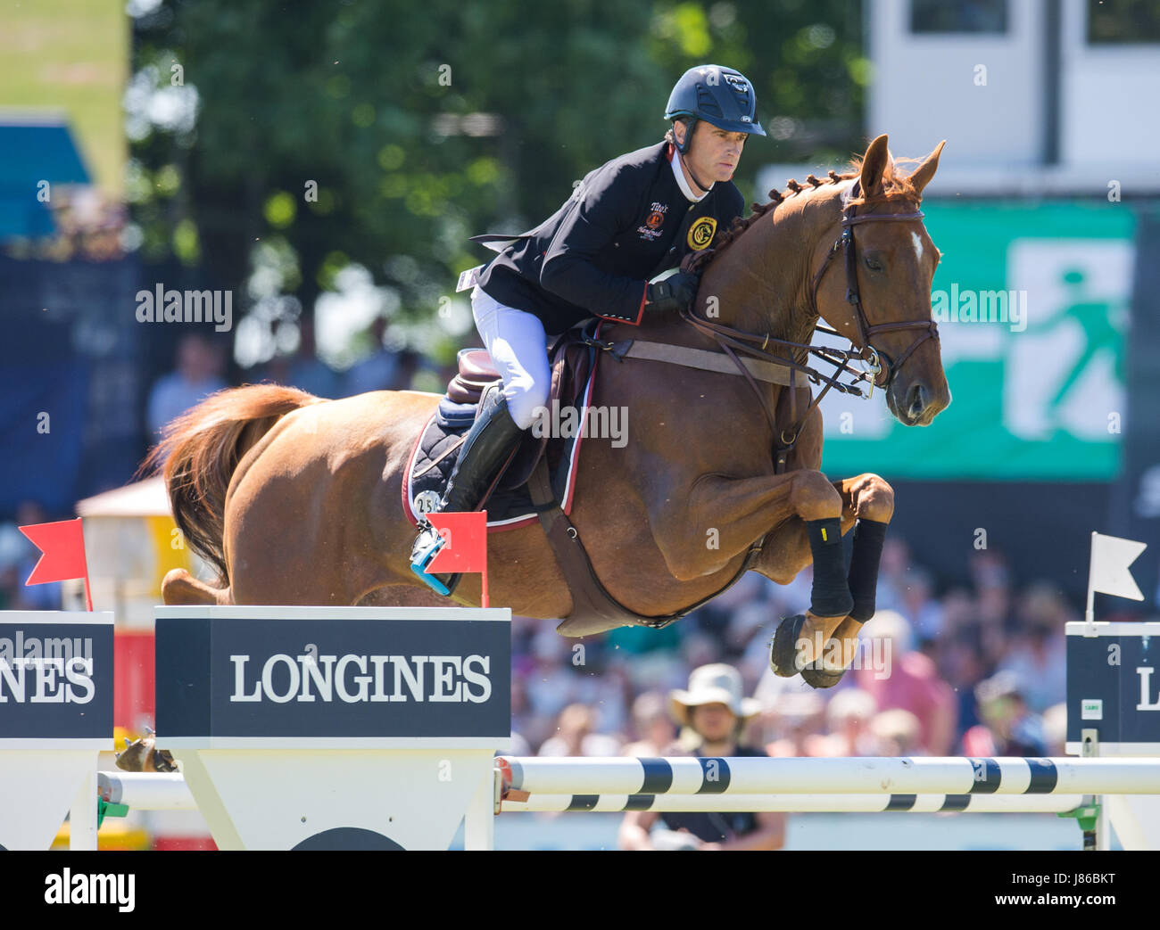 Klein Flottbeck, Germany. 27th May, 2017. Rider Deniy Lynch from Ireland and his horse RMF Echo jump over an obstacle during the Global Champions League in Hamburg in Klein Flottbeck, Germany, 27 May 2017. Photo: Daniel Bockwoldt/dpa/Alamy Live News Stock Photo