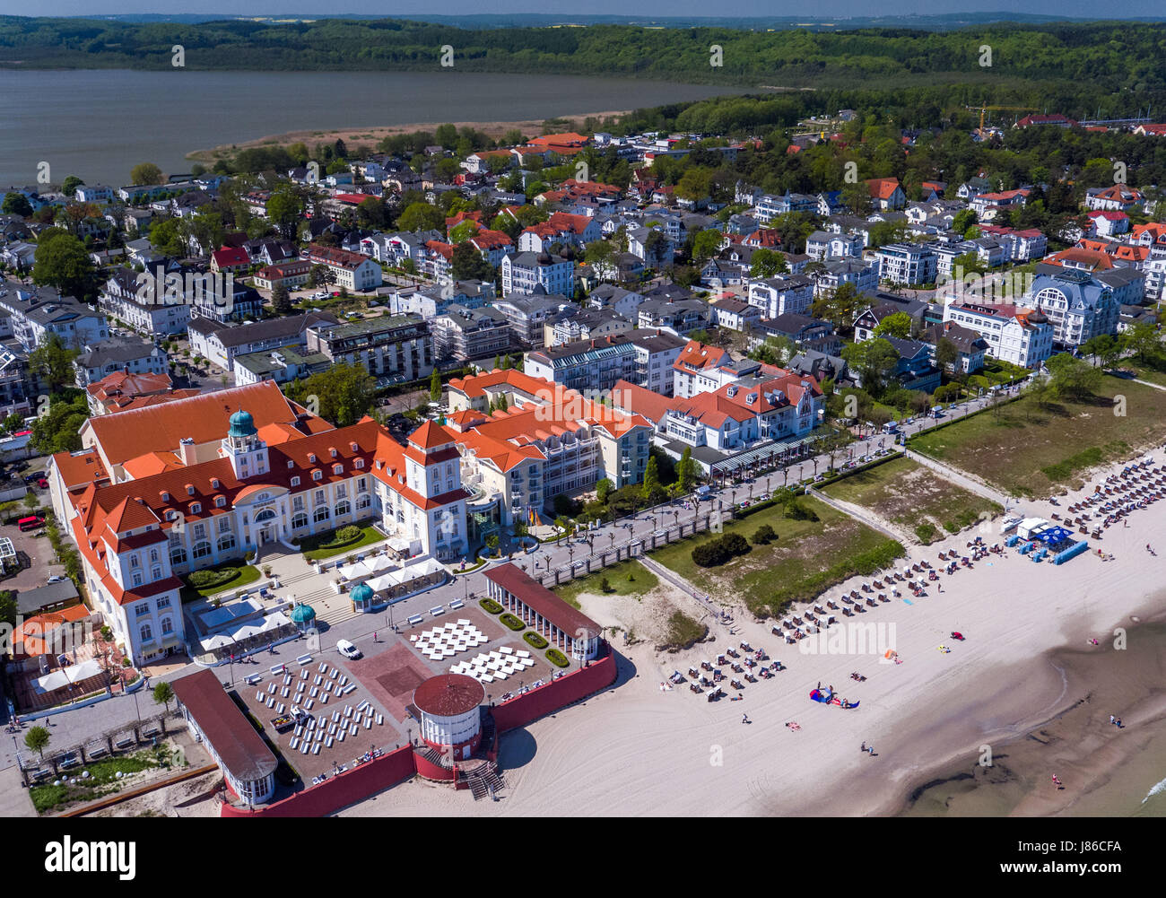 Binz, Germany. 18th May, 2017. The over 100 year old spa house with its adjoining park and the seaside promenade can be seen in Binz, Germany, 18 May 2017. Today the hotel, opened on the 3rd of July 1908, is greeting vacationers. For more than 30 million euros the "Travel Charme Groupe" from Berlin renovated the spa house Binz. It has now been reopened as a five-star-hotel since December 2001. Aerial View Taken with a Drone. Photo: Jens Büttner/dpa-Zentralbild/ZB/dpa/Alamy Live News Stock Photo