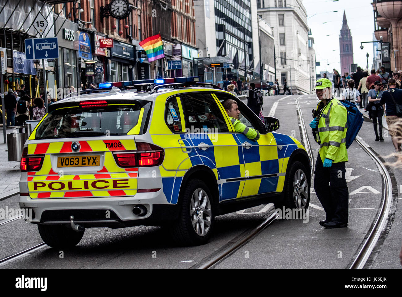 Birmingham, United Kingdom. 27th May 2017.  Armed police patrol the streets amid hightened security in the wake o the manchester bombing as thousands of members of the LGBTQ community gathered today for the Birmingham Pride parade. The Birmingham Pride is an annual festival for the LGBTQ community usually taking place over the Spring Bank Holiday.  The event begins with a parade from Victoria Square in the city centre to the Gay Village in Hurst Street Credit: Jim Wood/Alamy Live News Stock Photo