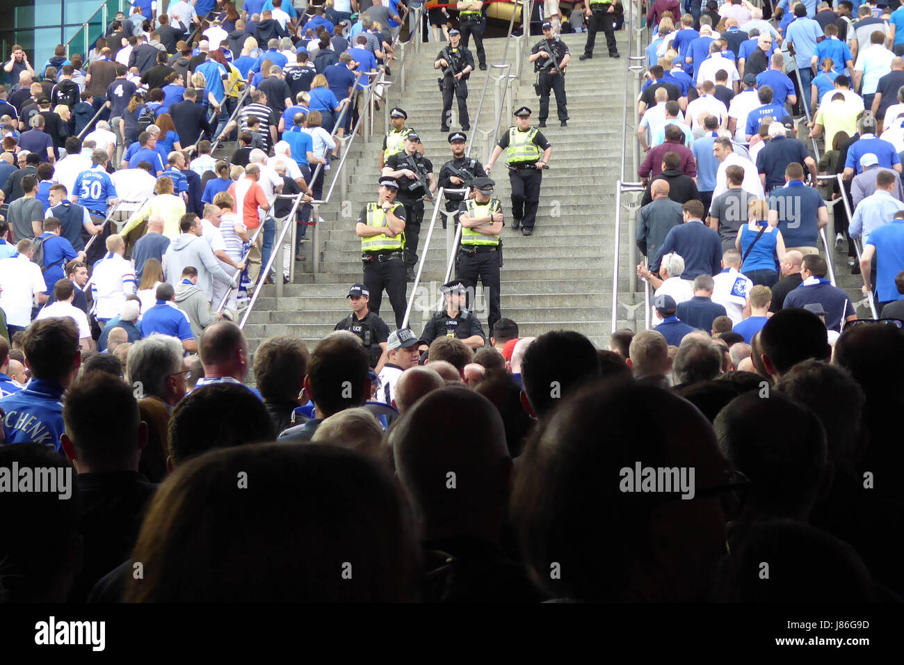 London, UK. 27th May, 2017. Police and armed police watch over FA Cup final fans at Wembley London Credit: Nigel Bowles/Alamy Live News Stock Photo