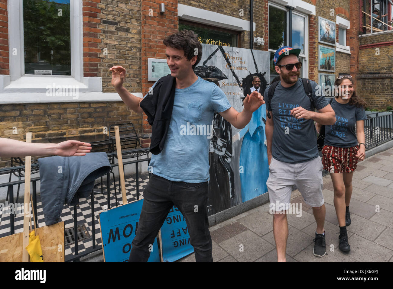 London, UK. 27th May, 2017. Workers walking out on strike from East Dulwich Picturehouse were greeted with cheers and applause from supporters. Supported by their union BECTU they demand trade union recognition, adequate sick pay, maternity and paternity pay and a living wage. Management at the company that made £93.8 million post-tax profit last year is refusing to meet with the workers. Credit: Peter Marshall/Alamy Live News Stock Photo