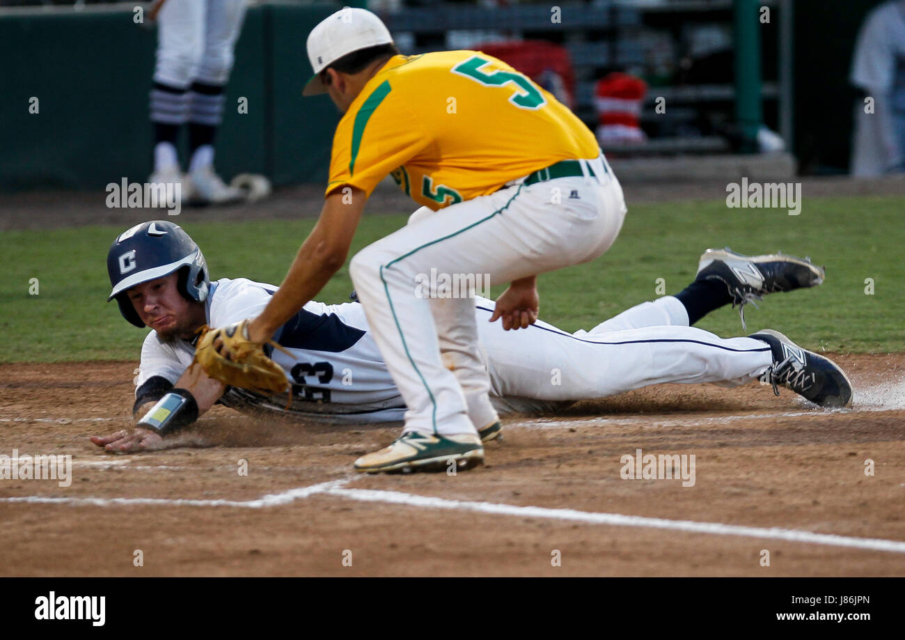 Fort Myers, Florida, USA. 27th May, 2017. MONICA HERNDON | Times.Matheu Nelson (63) of Calvary Christian, slides into home plate during the first inning of the FHSAA class 4A baseball championship against Pensacola Catholic on Friday May 27, 2017 at Hammond Stadium in Fort Myers, Fla. Calvary scored 6 runs in the first inning, and had 7 hits. Credit: Monica Herndon/Tampa Bay Times/ZUMA Wire/Alamy Live News Stock Photo