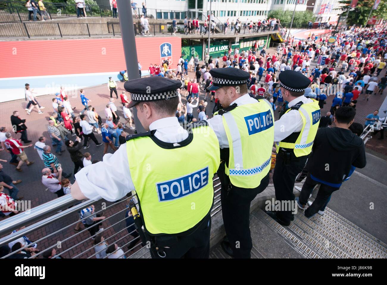 London, Britain. 27th May, 2017. Policemen are on patrol as security precautions are stepped up for Arsenal and Chelsea fans arriving at Wembley stadium for the FA Cup final in London, Britain, on May 27, 2017. The security level was in response to Manchester Arena bombing when 22 people died and 66 people were injured in one of the most deadly attacks in the UK. Credit: Ray Tang/Xinhua/Alamy Live News Stock Photo