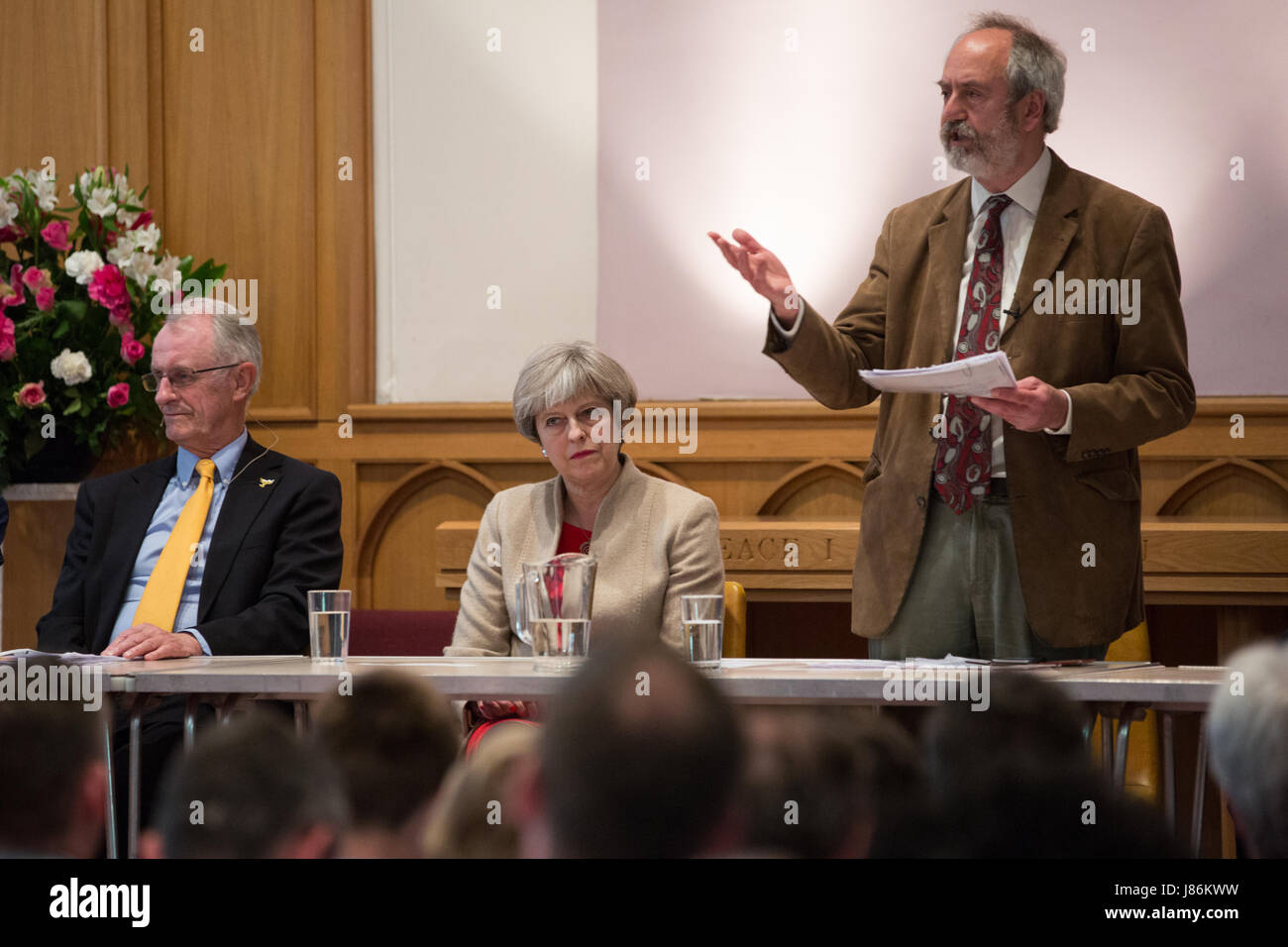 Maidenhead, UK. 27th May, 2017. Rabbi Dr Jonathan Romain (host) introduces a hustings event for the Maidenhead constituency for the forthcoming general election at the High Street Methodist Church, alongside (l-r)  Tony Hill (Liberal Democrat) and Theresa May (Conservative). Credit: Mark Kerrison/Alamy Live News Stock Photo