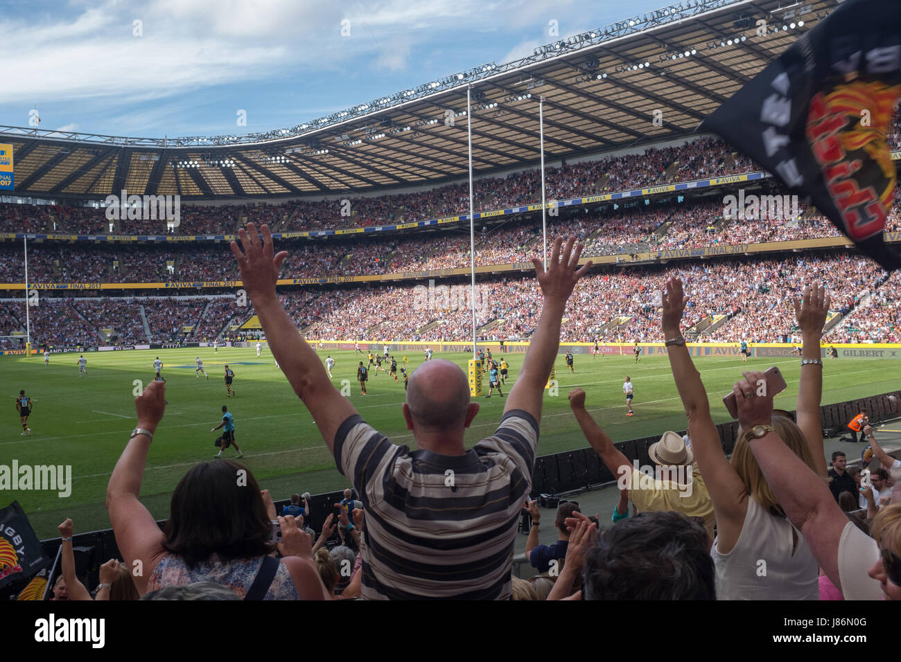 Twickenham, UK. 27th May, 2017. Exeter Chiefs fans cheer the final whistle in their victory over Wasps in extra time at Twickenham Credit: On Sight Photographic/Alamy Live News Stock Photo