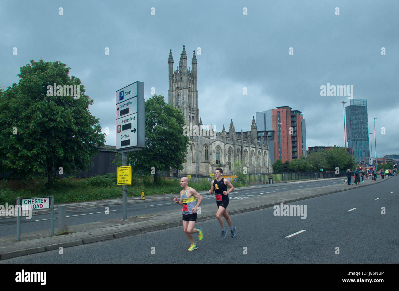 Manchester, UK. 28th May, 2017. Lead 2 runners in the Half Marathon event in the Great Manchester Run at Chester road Manchester. At the 9 mile mark . In rear ST Georges church and right the Beetham Tower. Picture Credit: GARY ROBERTS/Alamy Live News Stock Photo
