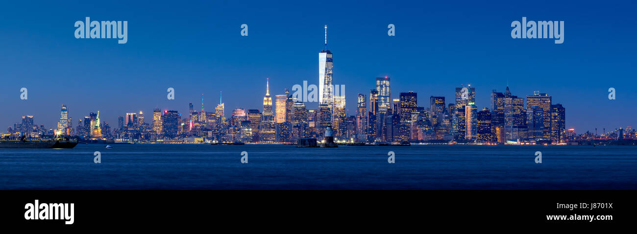 Panoramic view of Lower Manhattan and New York City Harbor with Financial District skyscrapers at twilight Stock Photo