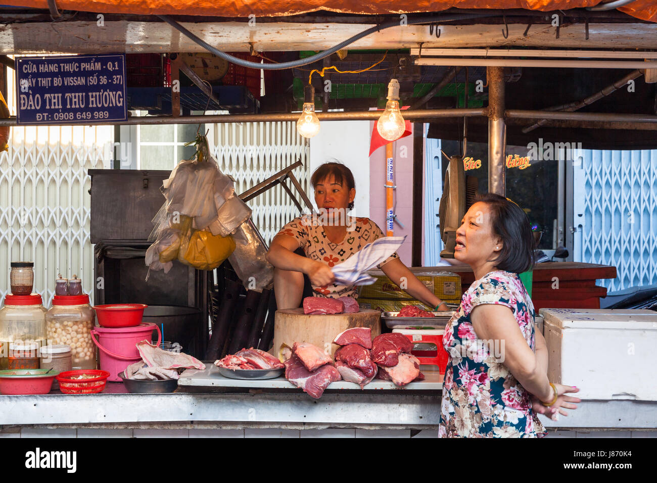 HO CHI MINH CITY, VIETNAM - FEBRUARY 07: Women are selling meat at the wet market on February 07, 2016 in Ho Chi Minh City, Vietnam. Stock Photo