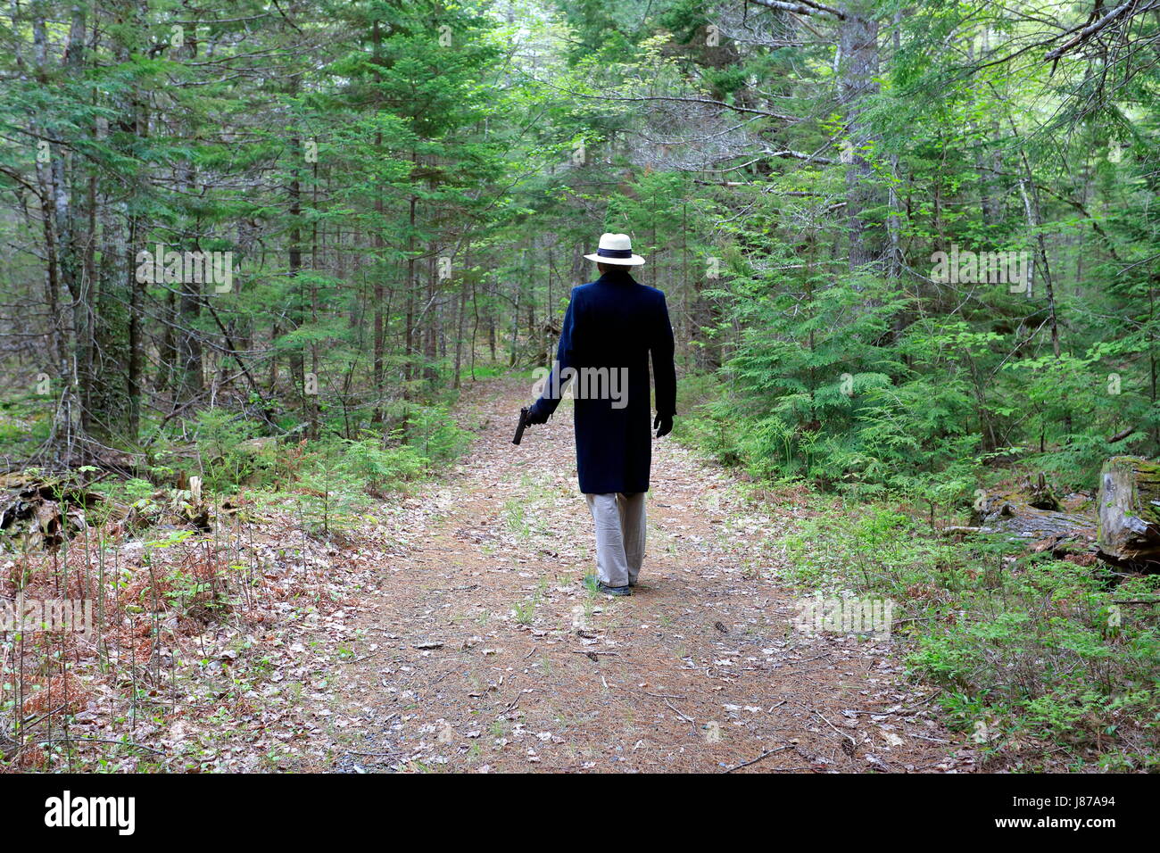 A killer with a gun photo for use as a murder mystery book cover Stock Photo