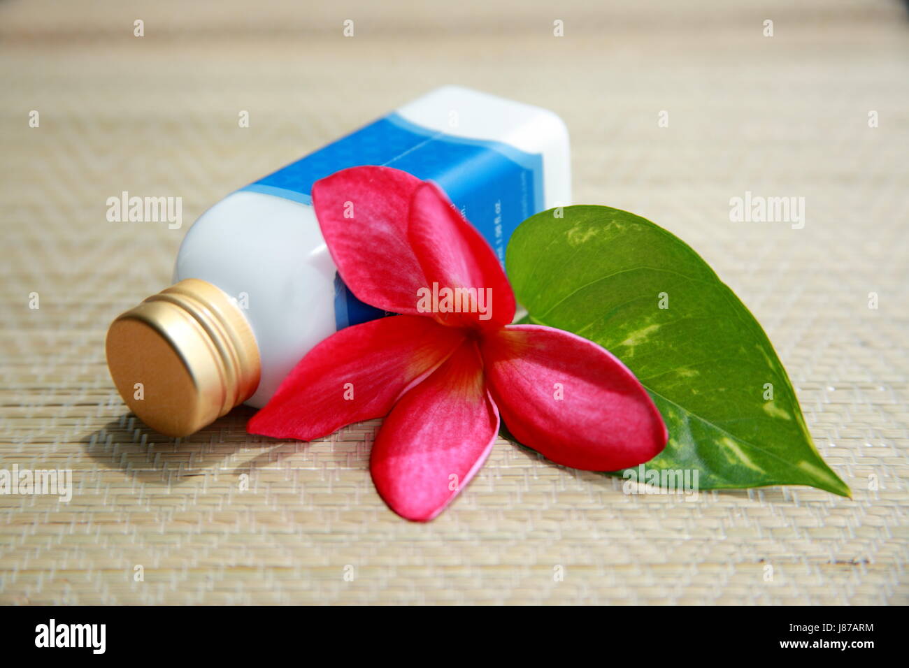lotion on bamboo mat Stock Photo