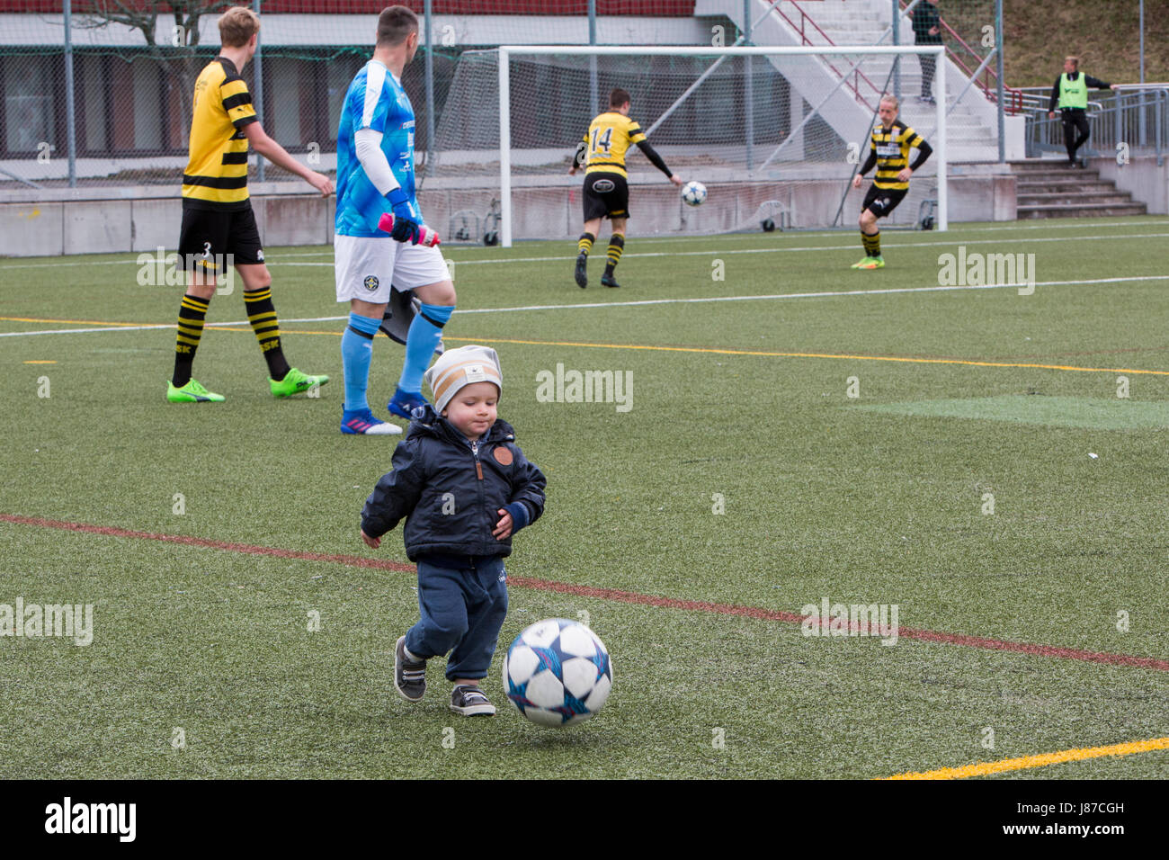 A little boy kicks ball, Spånga, Sweden. Stock Photo