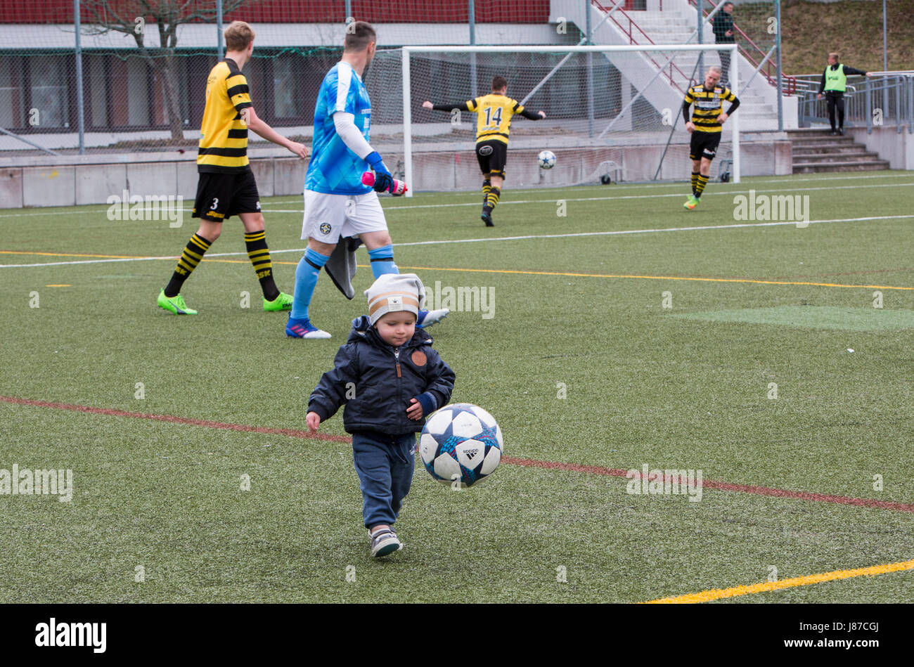 A little boy kicks ball, Spånga, Sweden. Stock Photo