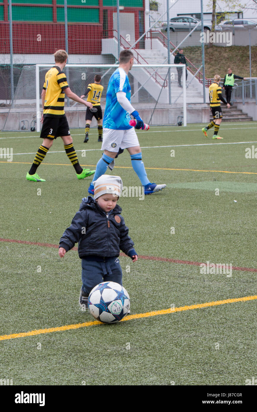 A little boy kicks ball, Spånga, Sweden. Stock Photo