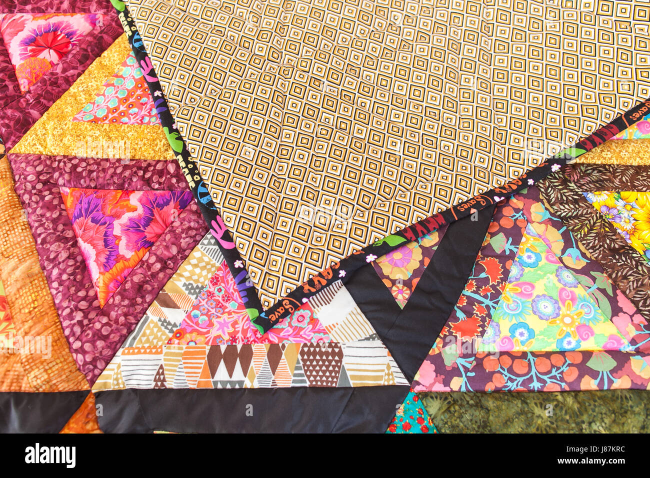 Patchwork quilt. Part of patchwork quilt as background. Handmade ...
