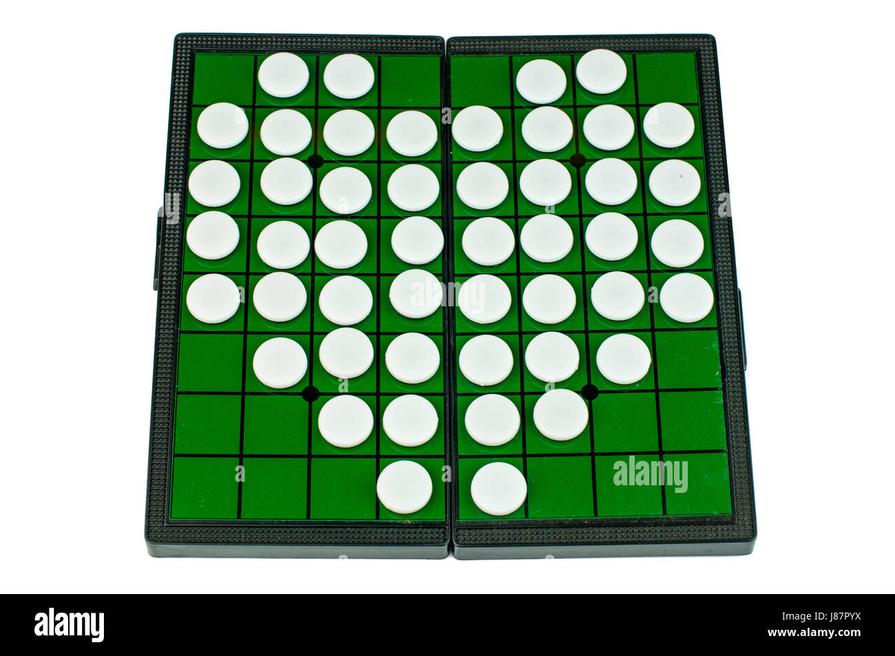 White Heart Shaped Othellos on Green Grid Othello Board Isolated Stock Photo