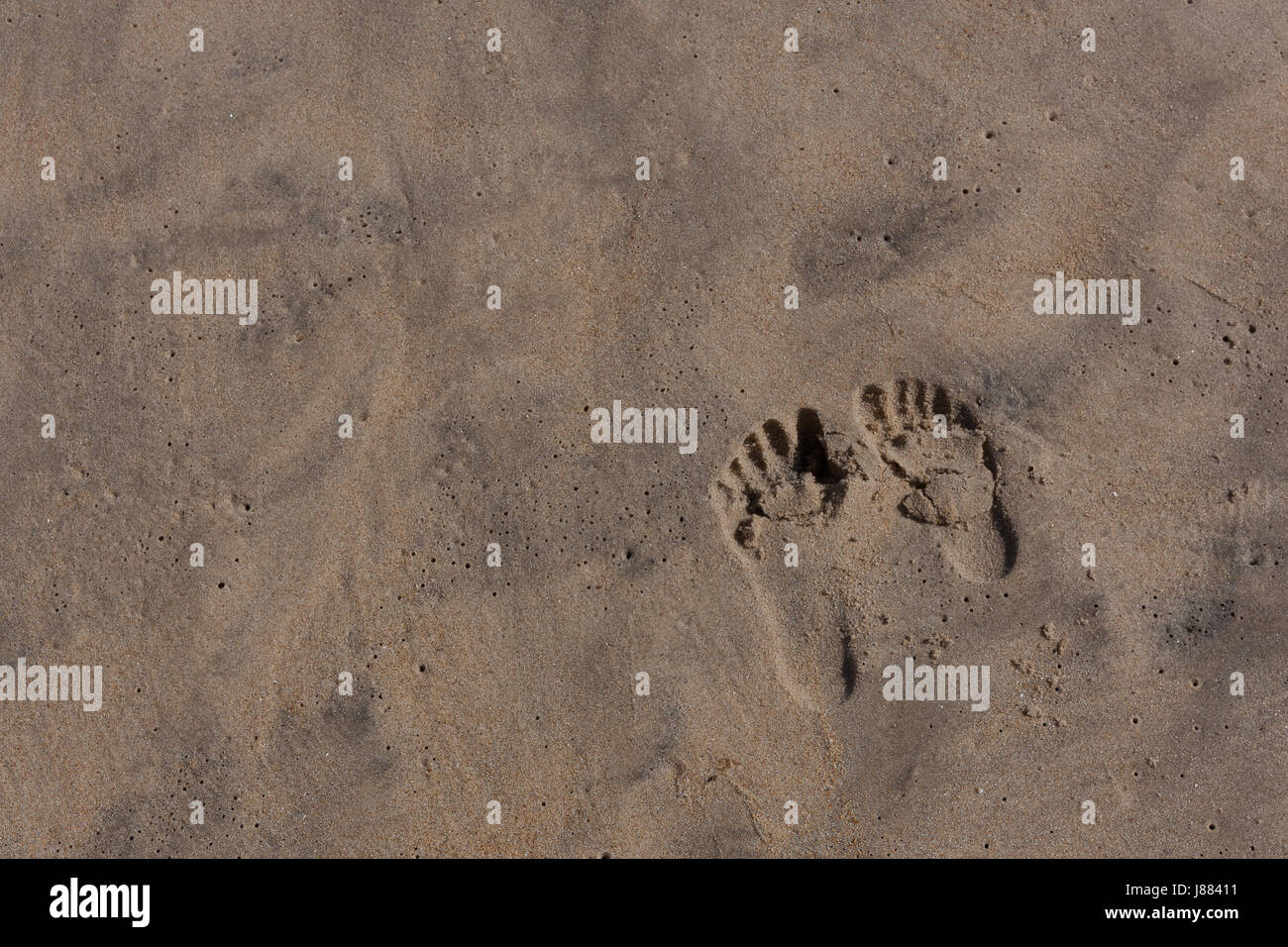 Kids Footprints in the Sand Stock Photo