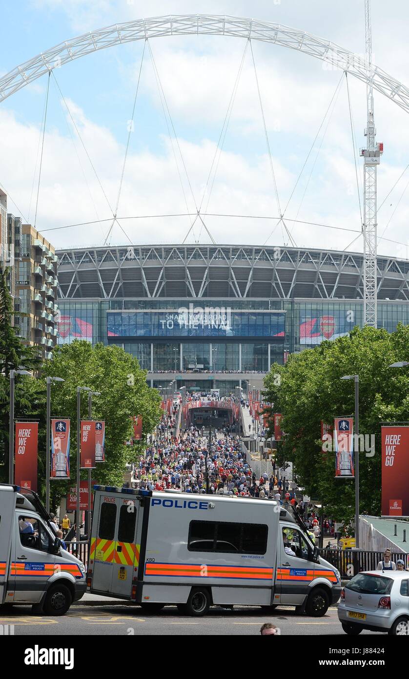 Police vans outside Wembley Stadium ahead of the FA Cup Final between  Arsenal and Chelsea, as Britons have been encouraged to enjoy their Bank  Holiday weekend as planned after police reviewed security