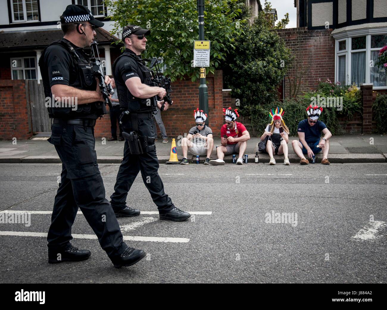 Armed police officers patrol outside the Aviva Premiership Rugby Final between Exeter and Wasps at Twickenham, as Britons have been encouraged to enjoy their Bank Holiday weekend as planned after police reviewed security at more than 1,300 events following the Manchester terror attack. Stock Photo