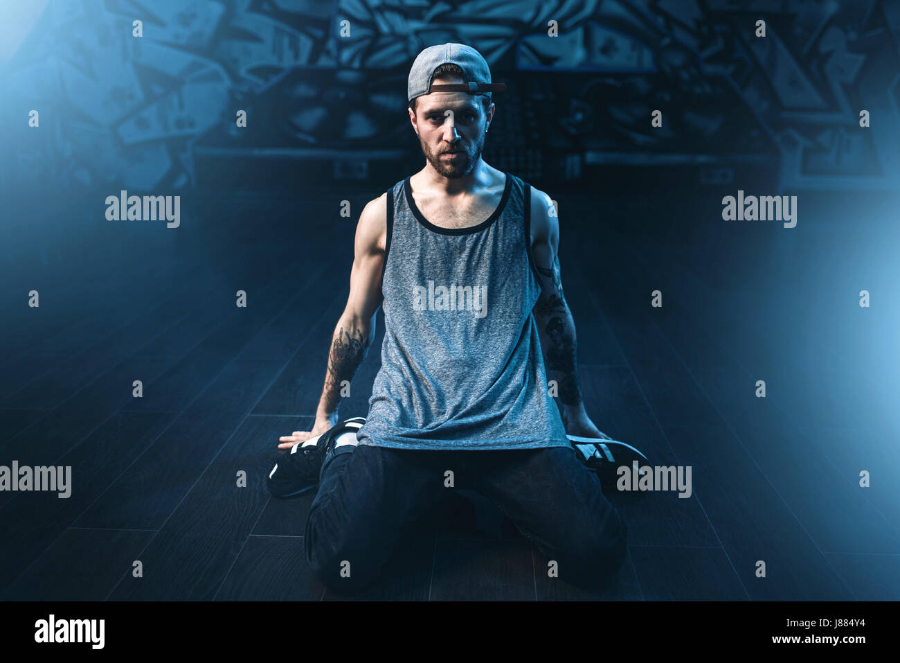 Male rapper in dance studio, trendy lifestyle. Modern urban dancing ...