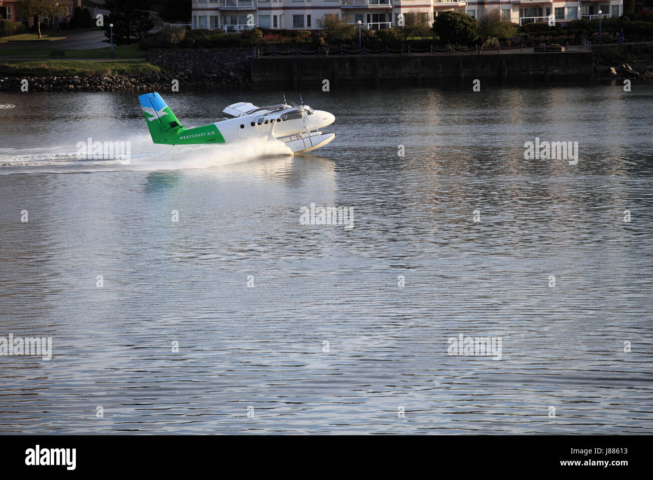 Tourists in a float plane landing in Victoria Harbor in Victoria Briitish Columbia. Stock Photo