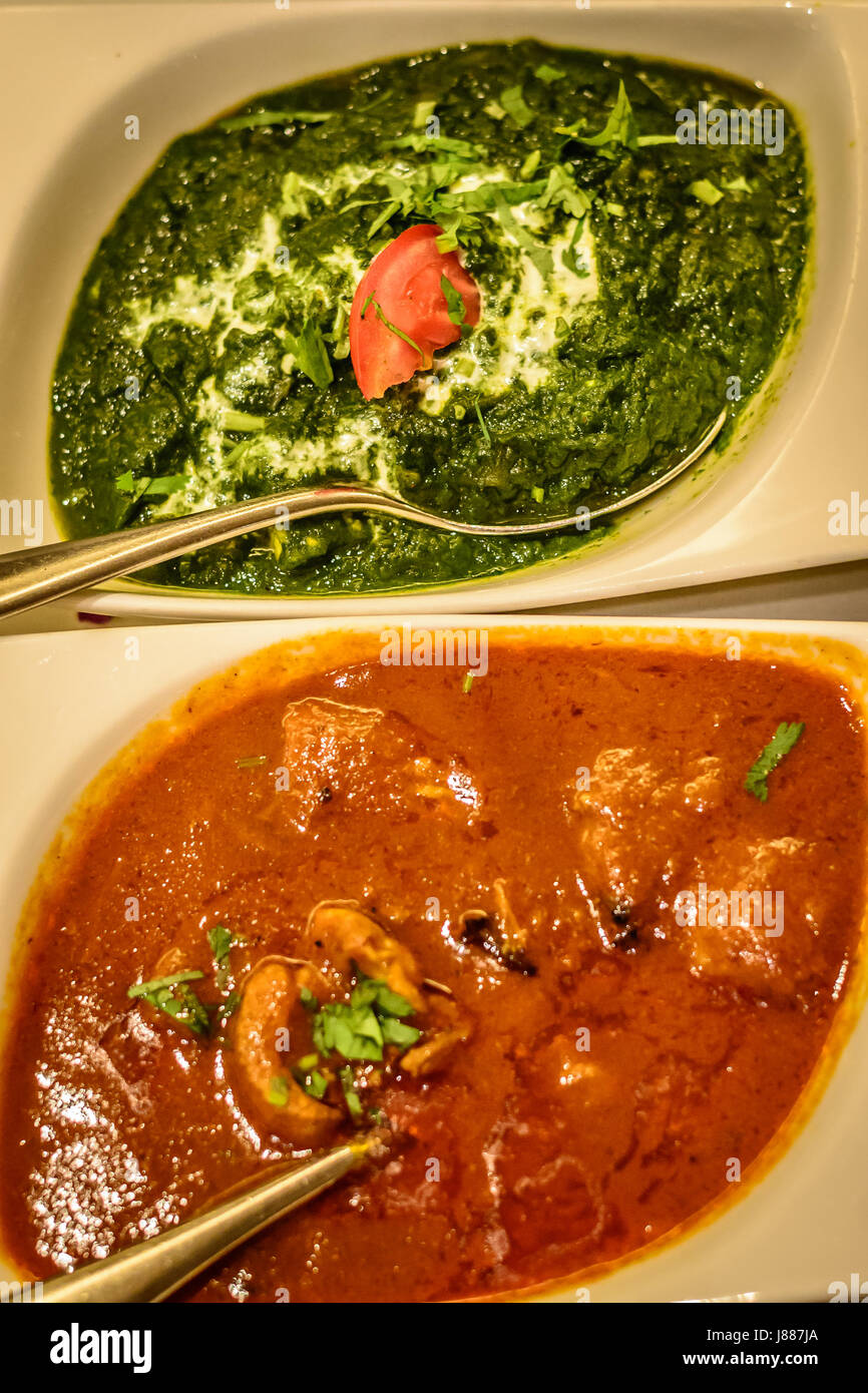 spinach in cream and chicken korma curry indian dishes Stock Photo Alamy