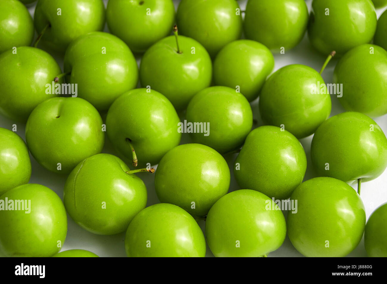 Sour plum pictures on white ground, wonderful sour plums Stock Photo
