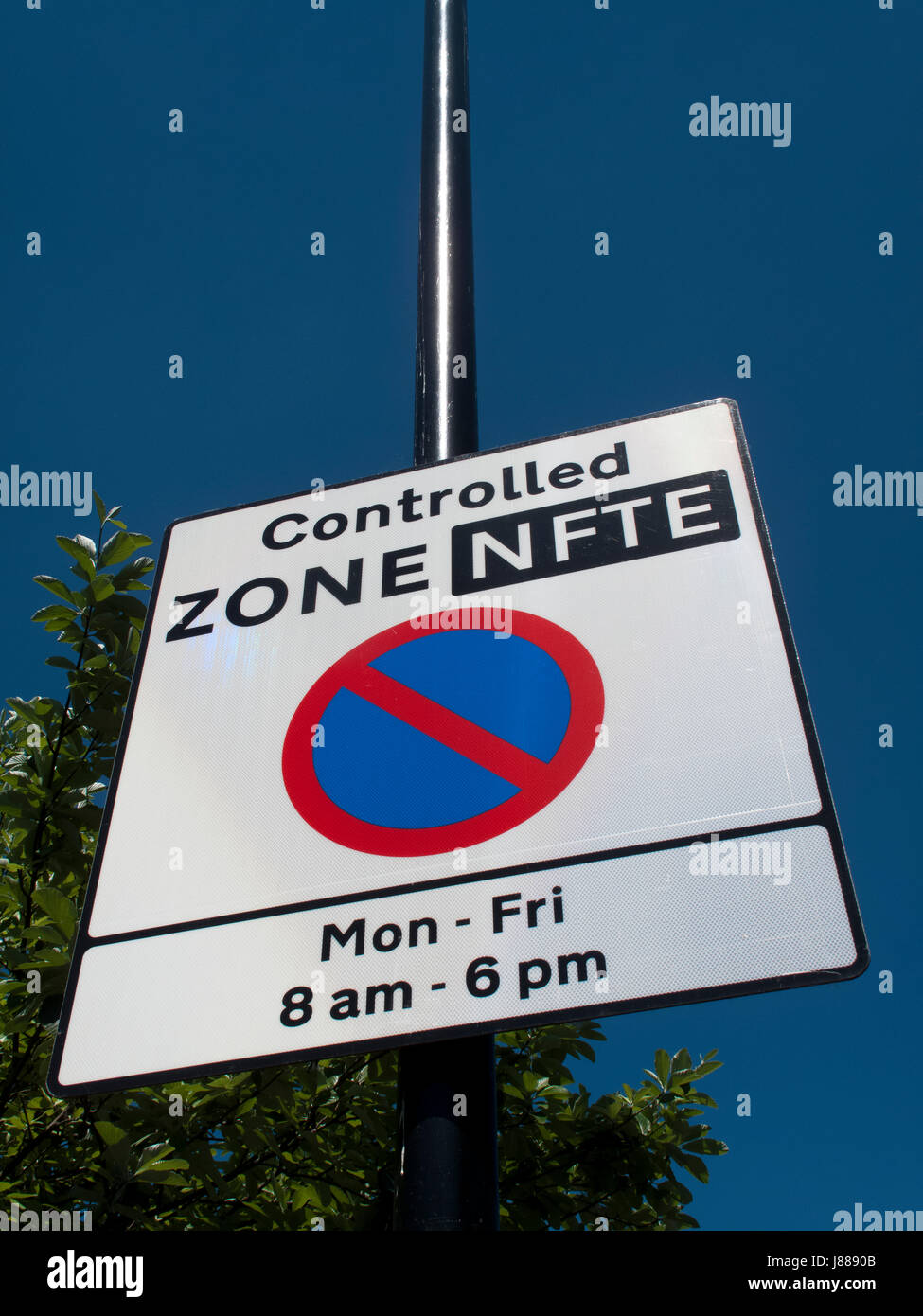 Controlled zone sign showing car parking restrictions between Monday