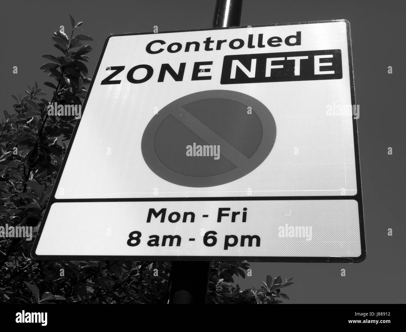 Controlled zone sign showing car parking restrictions between Monday