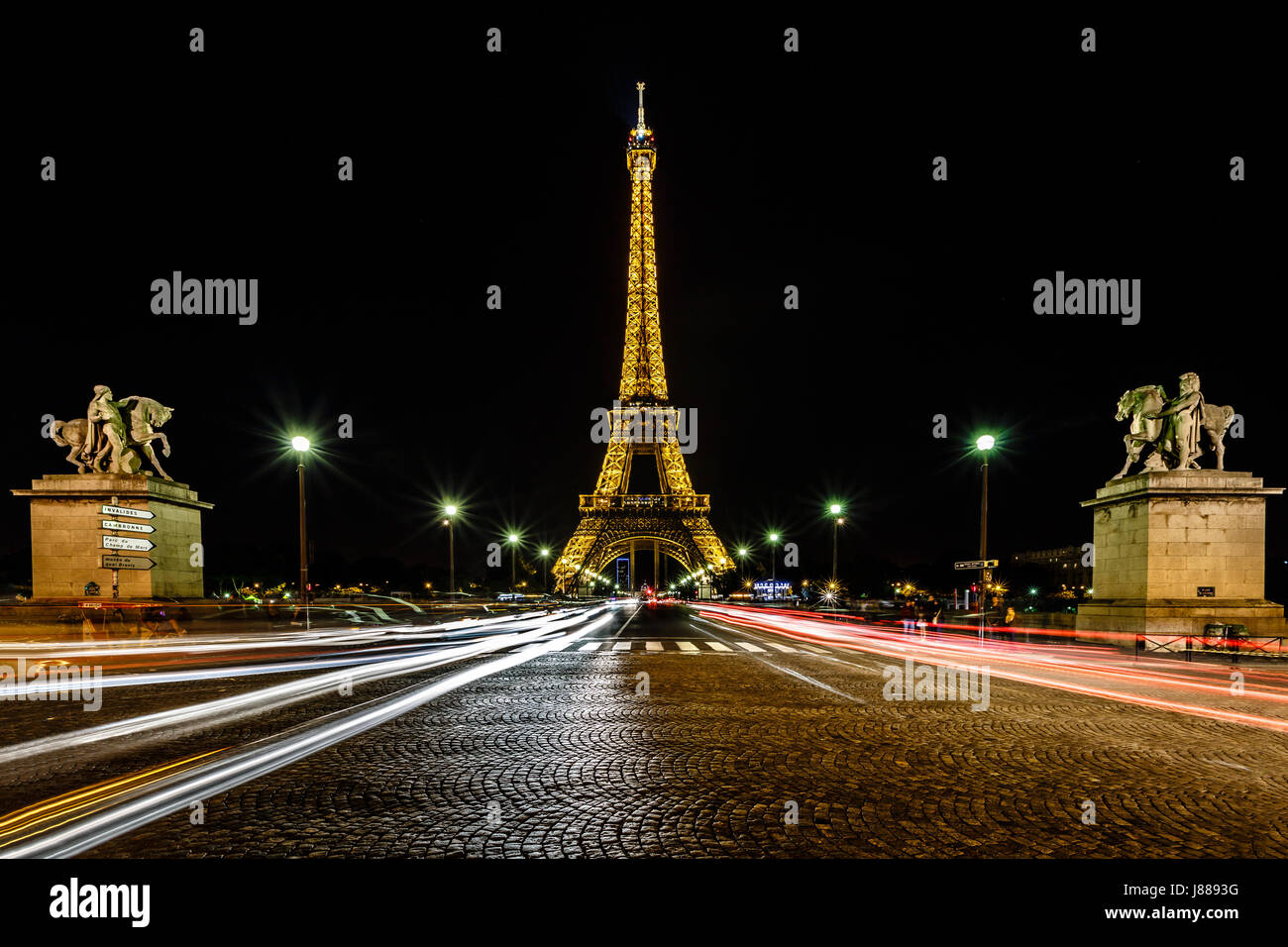 PARIS JUNE 29 Eiffel Tower light show and traffic light trails on
