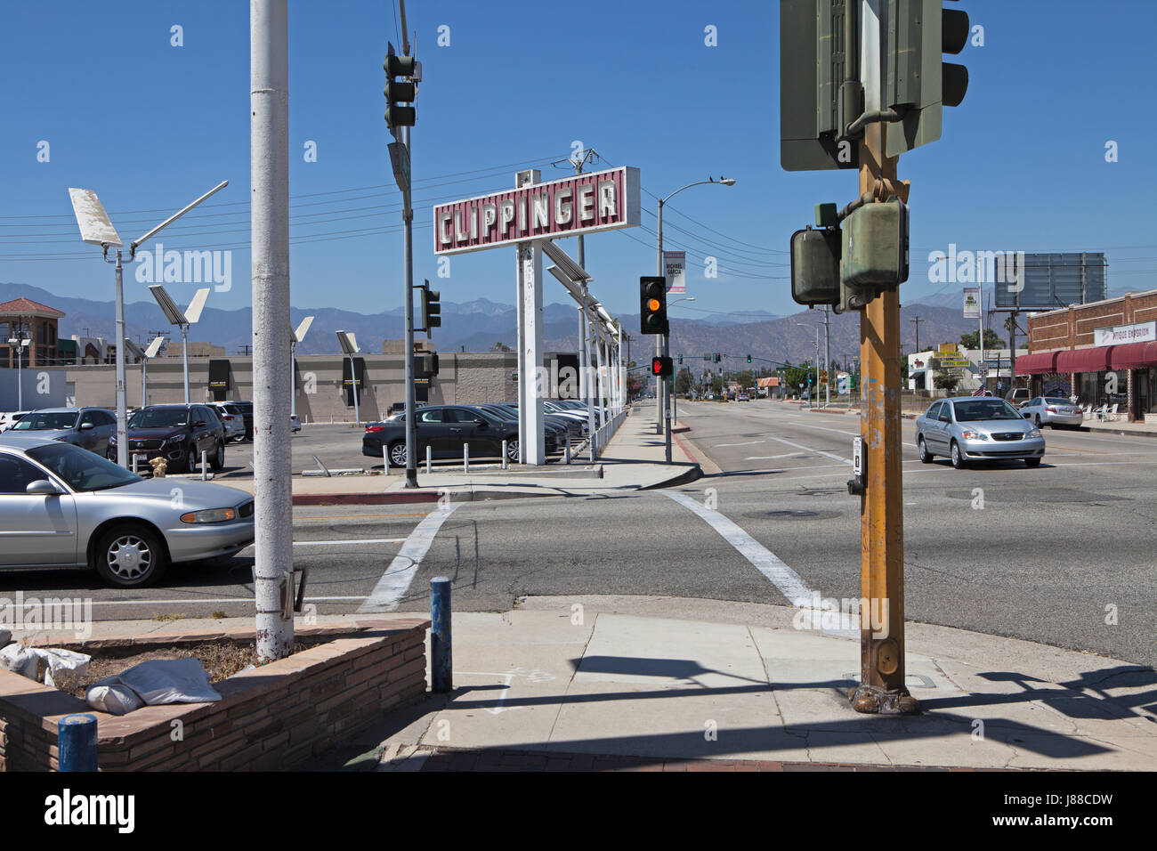 Used car dealership at intersection in Covina, CA Stock Photo Alamy