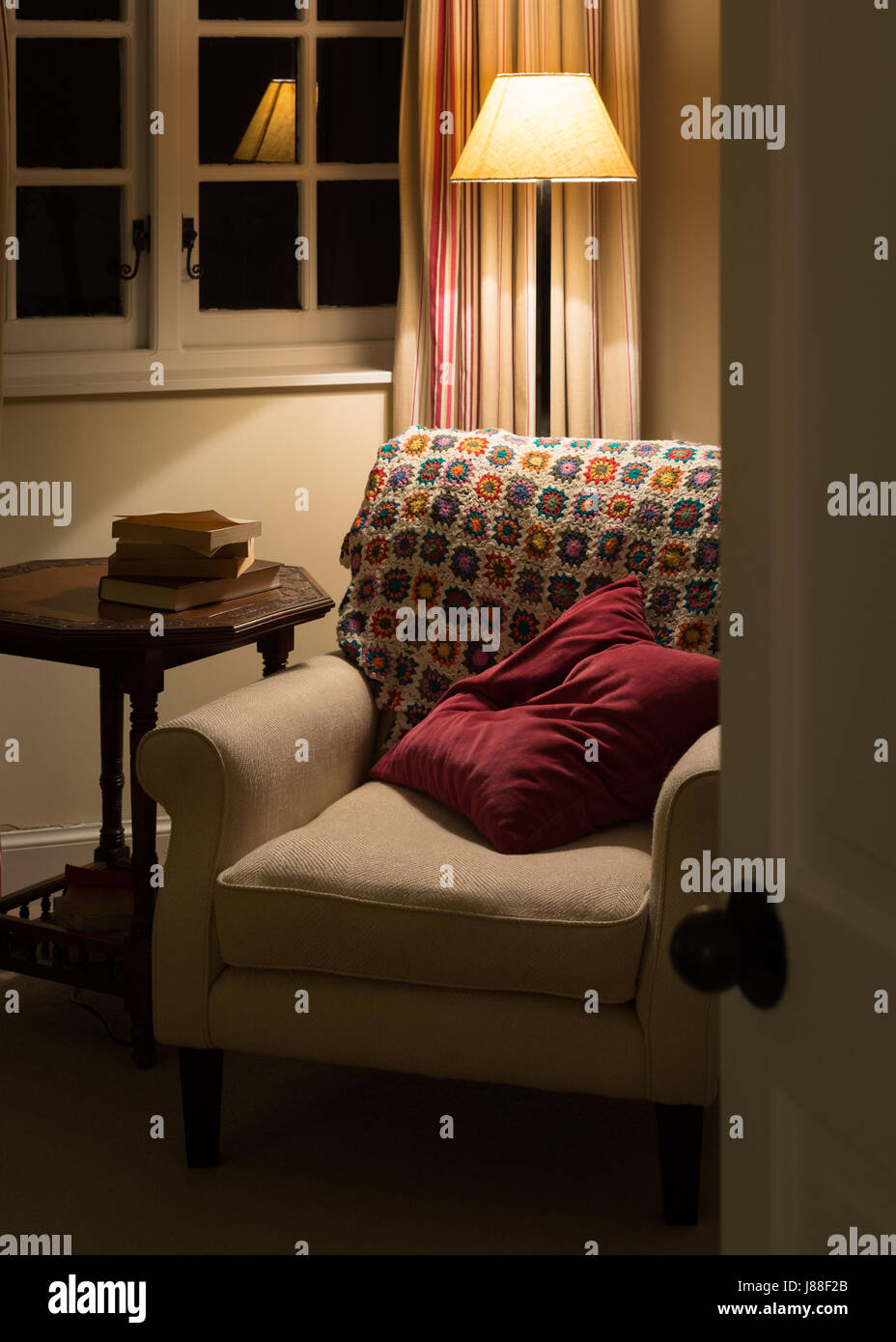 cosy armchair at night Stock Photo