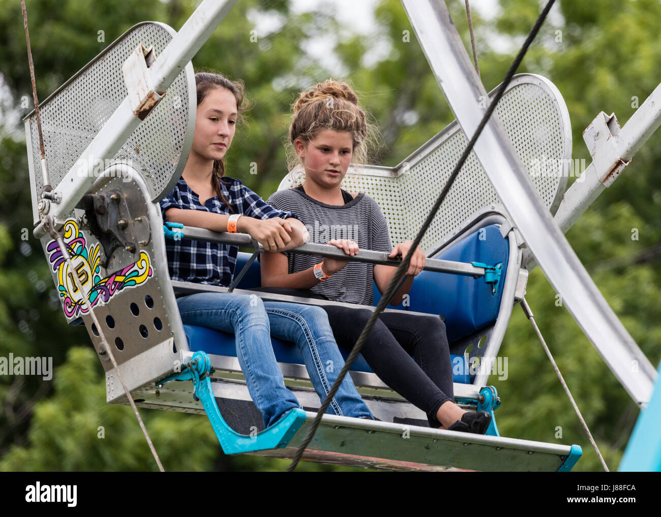 Fairgoers enjoying the rides at a county fair Stock Photo - Alamy