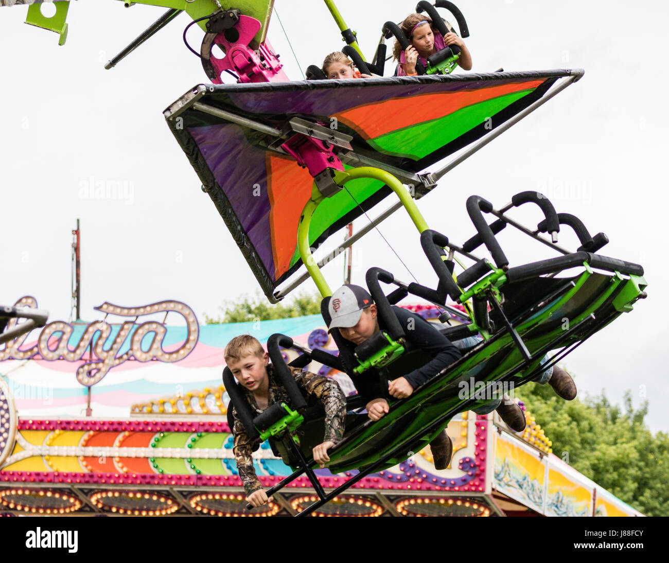Hang glider ride at the county fair Stock Photo - Alamy