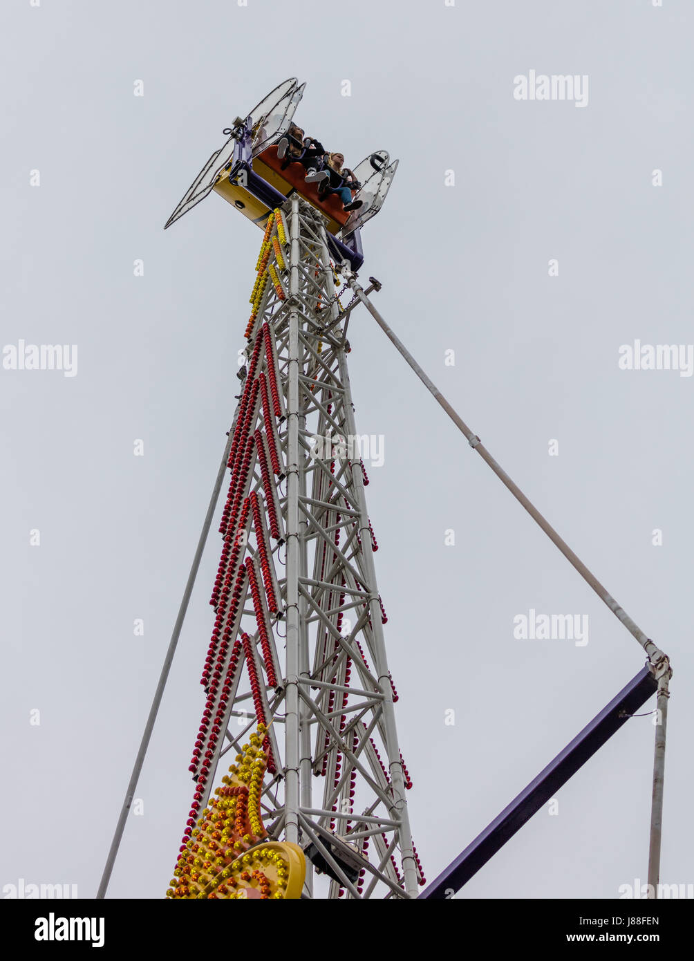 Children having fun on a ride at the county fair Stock Photo - Alamy