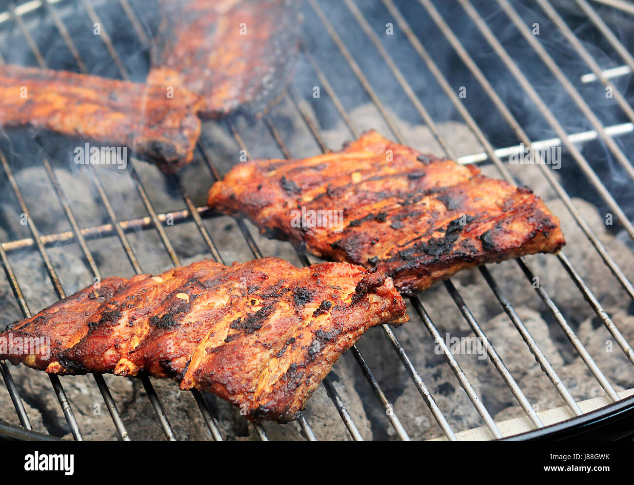 juicy ribs on the grill Stock Photo - Alamy