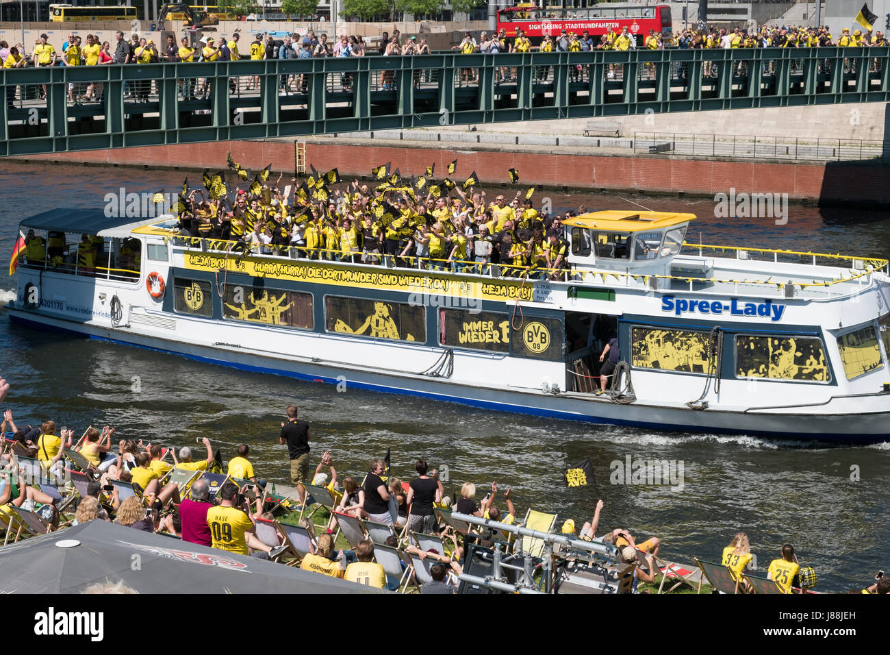Berlin, Germany - may 27, 2017: Many BVB Fans / Borussia Dortmund Fans on boat, riverside and bridge in  Berlin on the day of the DFB-Pokal final. Stock Photo