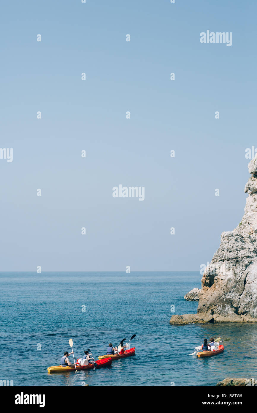 Kayaks at sea. Tourist kayaking in the sea near Dubrovnik, Croatia