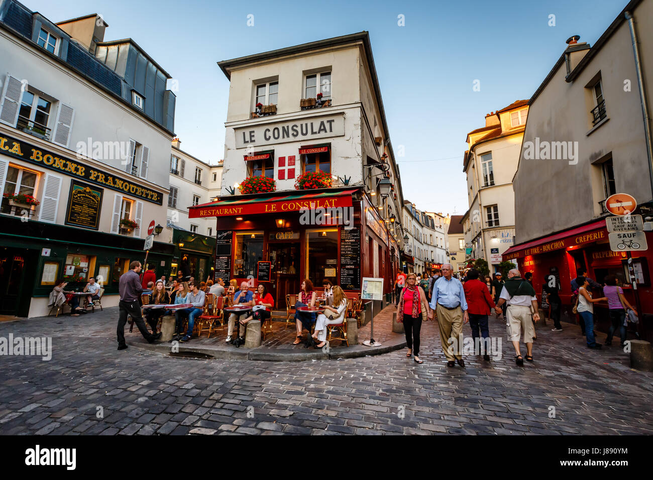 PARIS - July 1: View of typical paris cafe on July 1, 2013 in Paris. Montmartre area is among most popular destinations in Paris, Le Consulat is a typ Stock Photo