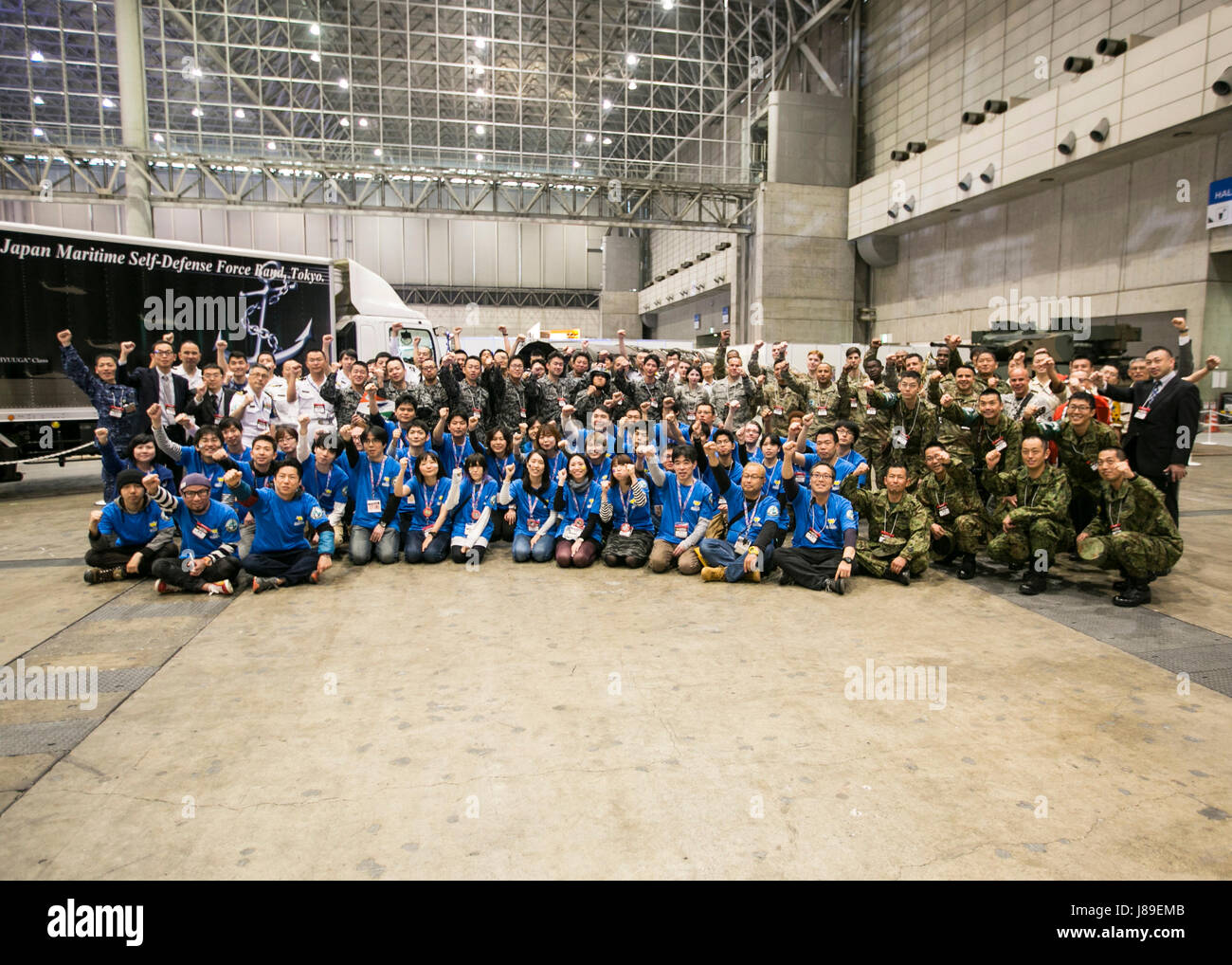 The 'Niconico Festival' is a multicultural entertainment and cosplay convention held annually at Muhari Messe in Tokyo, April 30, 2017.  U.S. Army Japan Soldiers, Air Force airmen,  Japan Ground Self-Defense Force and Niconico staff take a group photo. This bilateral event was designed to promote U.S. Army Japan and Japan Ground Self-Defense Force organizations. Stock Photo