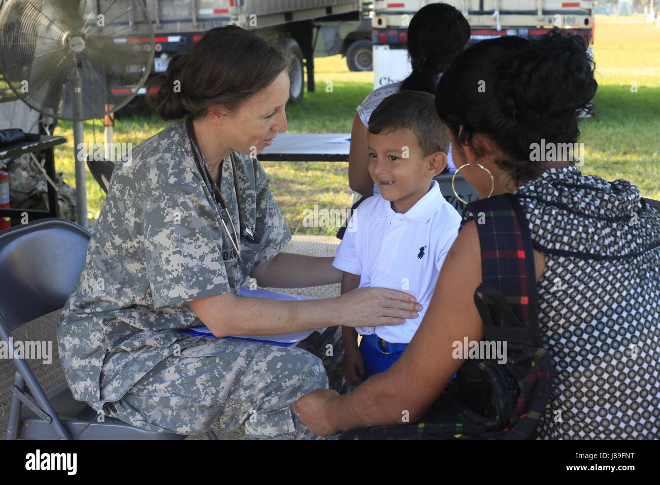U.S. Army Lt. Col. Amy Surdam, with the Wyoming National Guard Medical Detachment, assess a patient's breathing at a medical readiness event during Beyond the Horizon 2017, in San Ignacio, Belize, May 15, 2017. BTH 2017 is a U.S. Southern Command-sponsored, Army South-led exercise designed to provide humanitarian and engineering services to communities in need, demonstrating U.S. support for Belize. (U.S. Army photo by Spc. Kelson Brooks) (RELEASED) Stock Photo