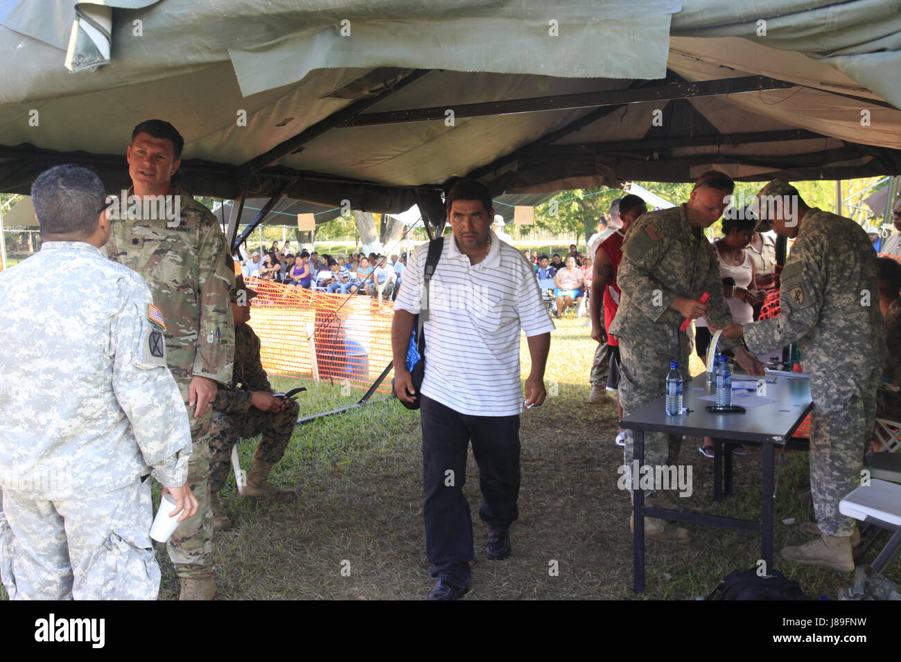 U.S. Army Soldiers check local citizens into a medical readiness event during Beyond the Horizon 2017, in San Ignacio, Belize, May 15, 2017. BTH 2017 is a U.S. Southern Command-sponsored, Army South-led exercise designed to provide humanitarian and engineering services to communities in need, demonstrating U.S. support for Belize. (U.S. Army photo by Spc. Kelson Brooks) (RELEASED) Stock Photo