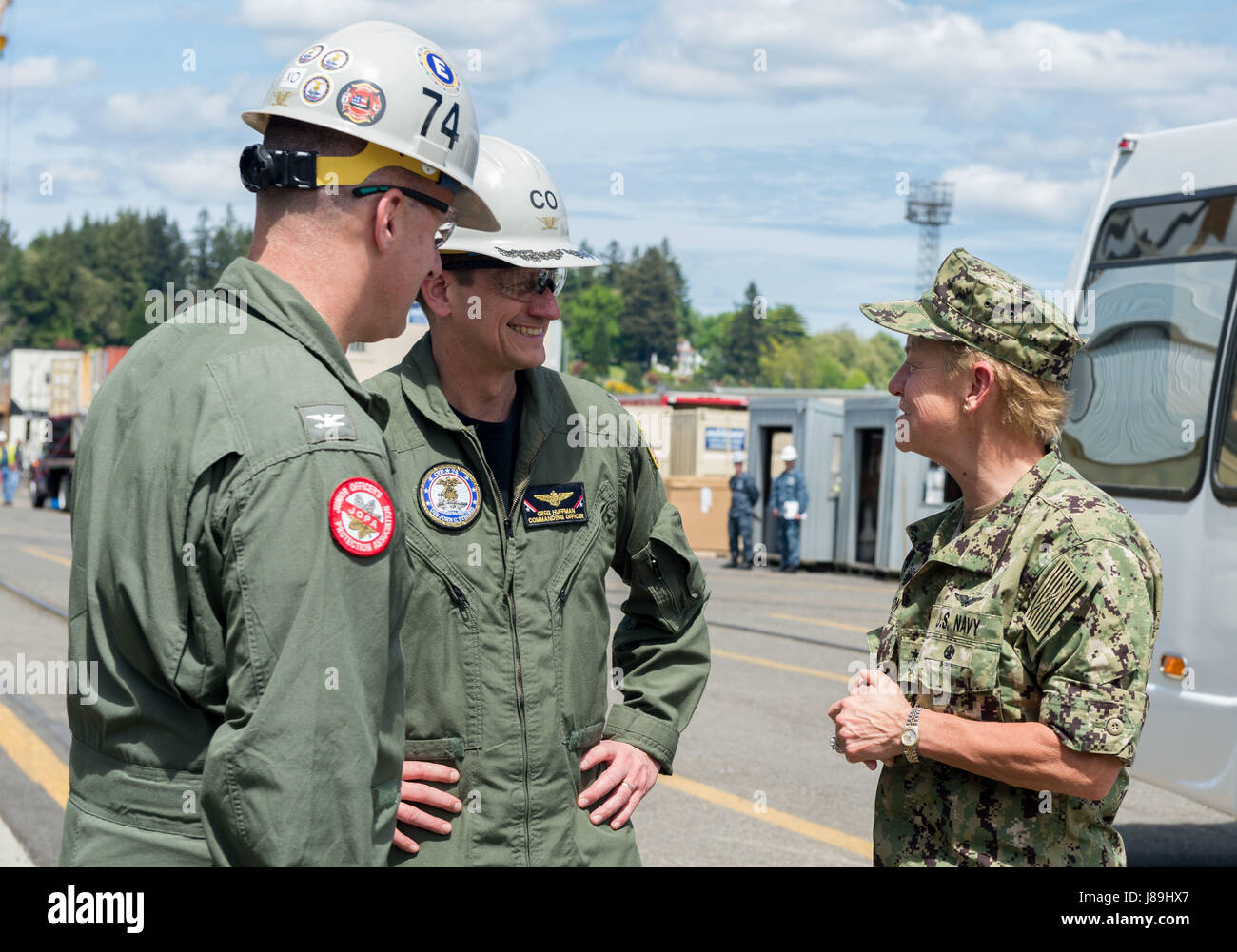 170519-N-BR087-106 BREMERTON, Washington (May 19, 2017) Vice Adm. Nora Tyson, commander, U.S. 3rd Fleet, greets Capt. Gregory Huffman, commanding officer of USS John C. Stennis (CVN 74), and Capt. Scott Miller, executive officer, during a visit to speak with Sailors. Tyson is visiting the Pacific Northwest to speak with Sailors during various all hands calls around Naval Base Kitsap and to serve as grand marshal of the 69th annual Bremerton Armed Forces Day Parade. John C. Stennis is conducting a planned incremental availability (PIA) at Puget Sound Naval Shipyard and Intermediate Maintenance  Stock Photo