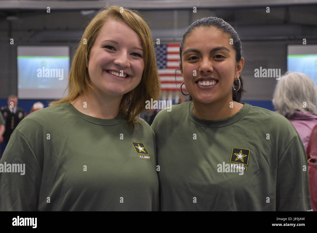 Mikaila Falash (left) and Anubis Ruiz Martinez (right) after receiving an "Our Community Salutes" certificate from Medal of Honor recipient Command Sergeant Major (Ret.) Kenneth E. Stumpf and Fort McCoy Senior Commander and 88th Regional Support Command Commanding General, Maj. Gen. Patrick Reinert during an “Our Community Salutes” event at Fort McCoy, Wisconsin on Armed Forces Day, May 20, to recognize and honor graduating high school seniors who have committed to enlist in the Armed Forces following high school graduation. Stock Photo
