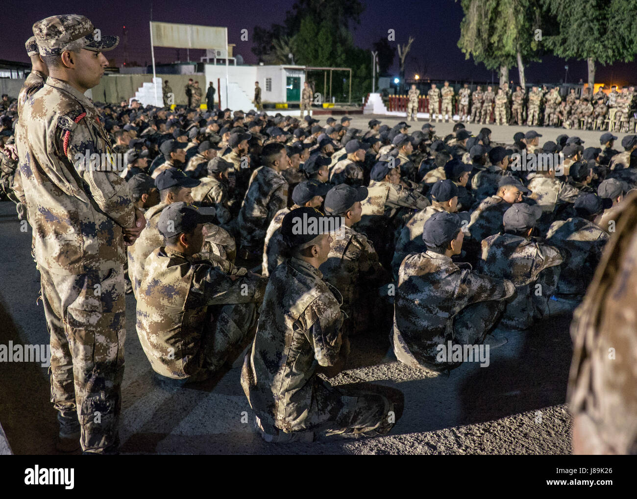 Iraqi special operations forces members participate in a ceremony