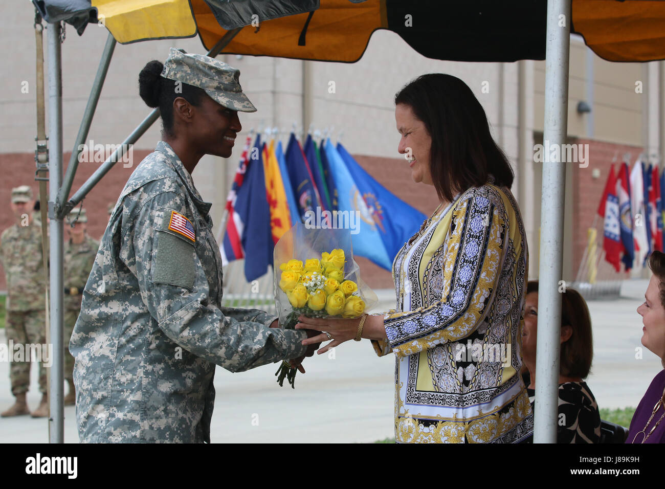Mrs. Sandy Hagenbeck receives followers during the change of command