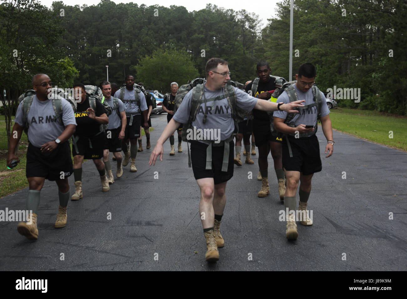 Army personnel conduct a timed ruck march in Wilson, North Carolina to ...
