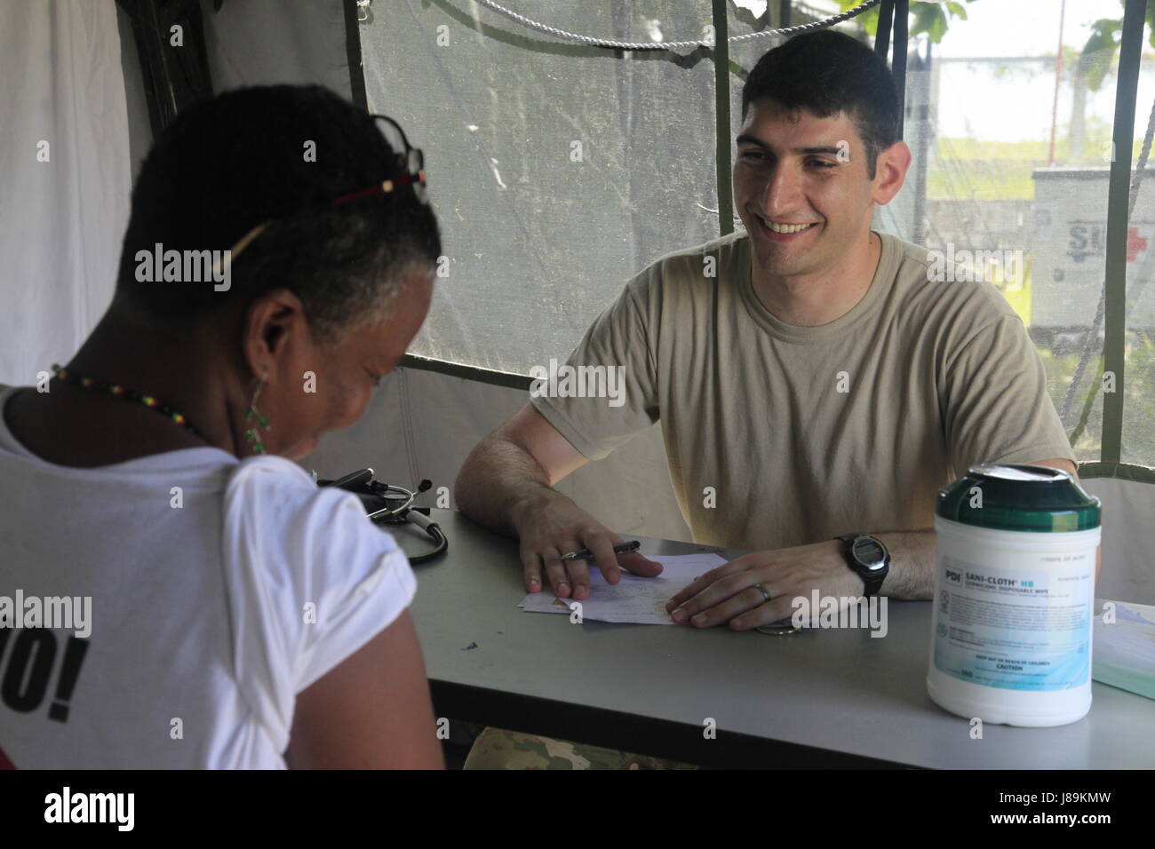 U.S. Army Captain Ilya Ryaboy, with the Brooke Army Medical Center from Fort Sam Houston, Texas, evaluates a patient's health at a medical readiness event in Dangriga, Belize, May 22, 2017. This is the third and final medical event scheduled for Beyond the Horizon 2017, a U.S. Southern Command-sponsored, Army South-led exercise designed to provide humanitarian and engineering services to communities in need, demonstrating U.S. support for Belize. (U.S. Army photo by Spc. Kelson Brooks) (RELEASED) Stock Photo